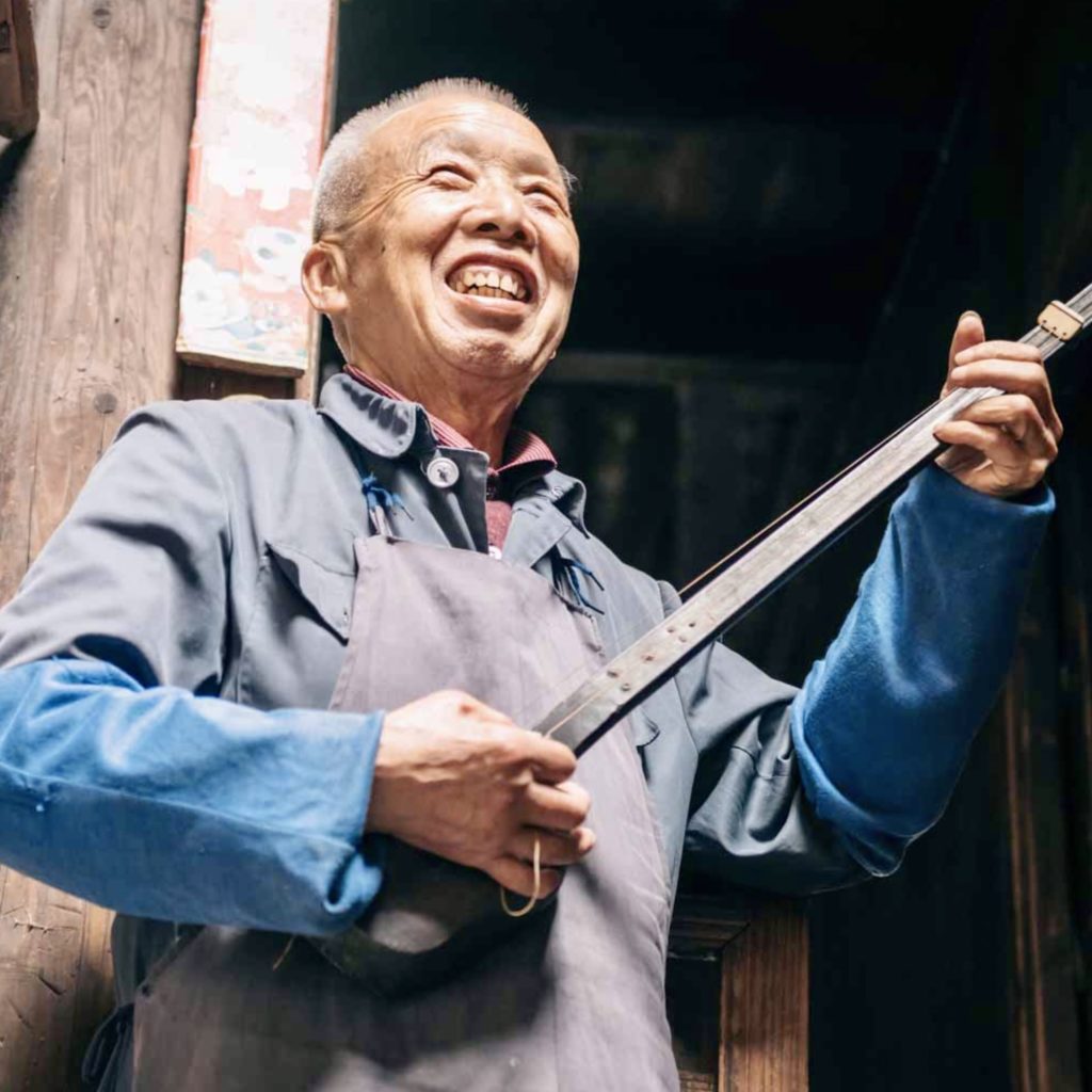 Meet friendly locals like this Chinese shamisen player when you take a tailor-made holiday with Alfred&