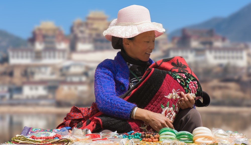 Meet friendly locals like this lady in Shangri-La when you take a tailor-made holiday with Alfred&