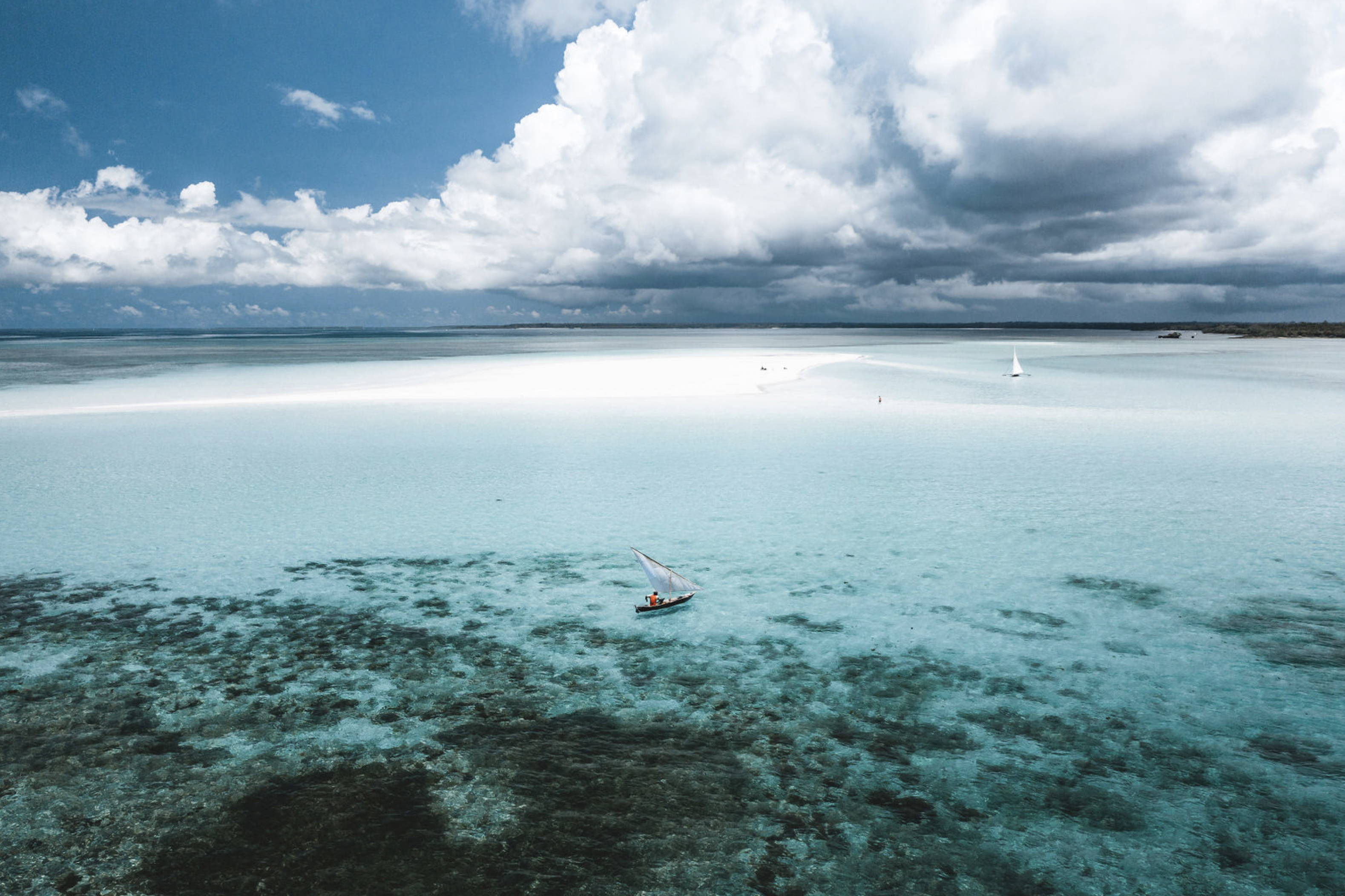 Experience romantic Tanzanian backdrops like this dhow-dotted azure water surrounding Pemba Island when you take a tailor-made holiday with Alfred&.