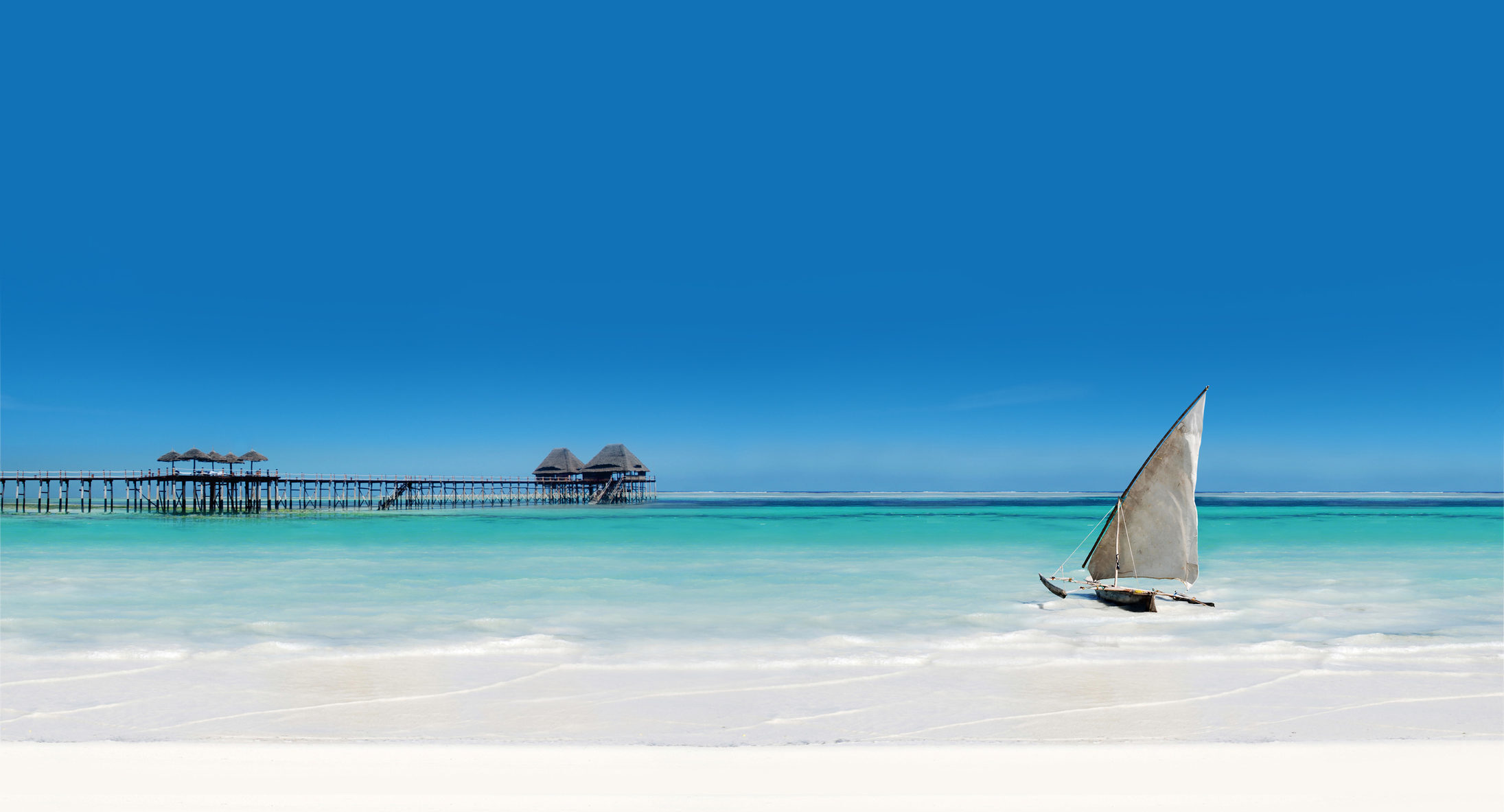 Witness extraordinary Zanzibar beachscape like this blazing white sand and azure Indian Ocean when you take a tailor-made holiday with Alfred&.