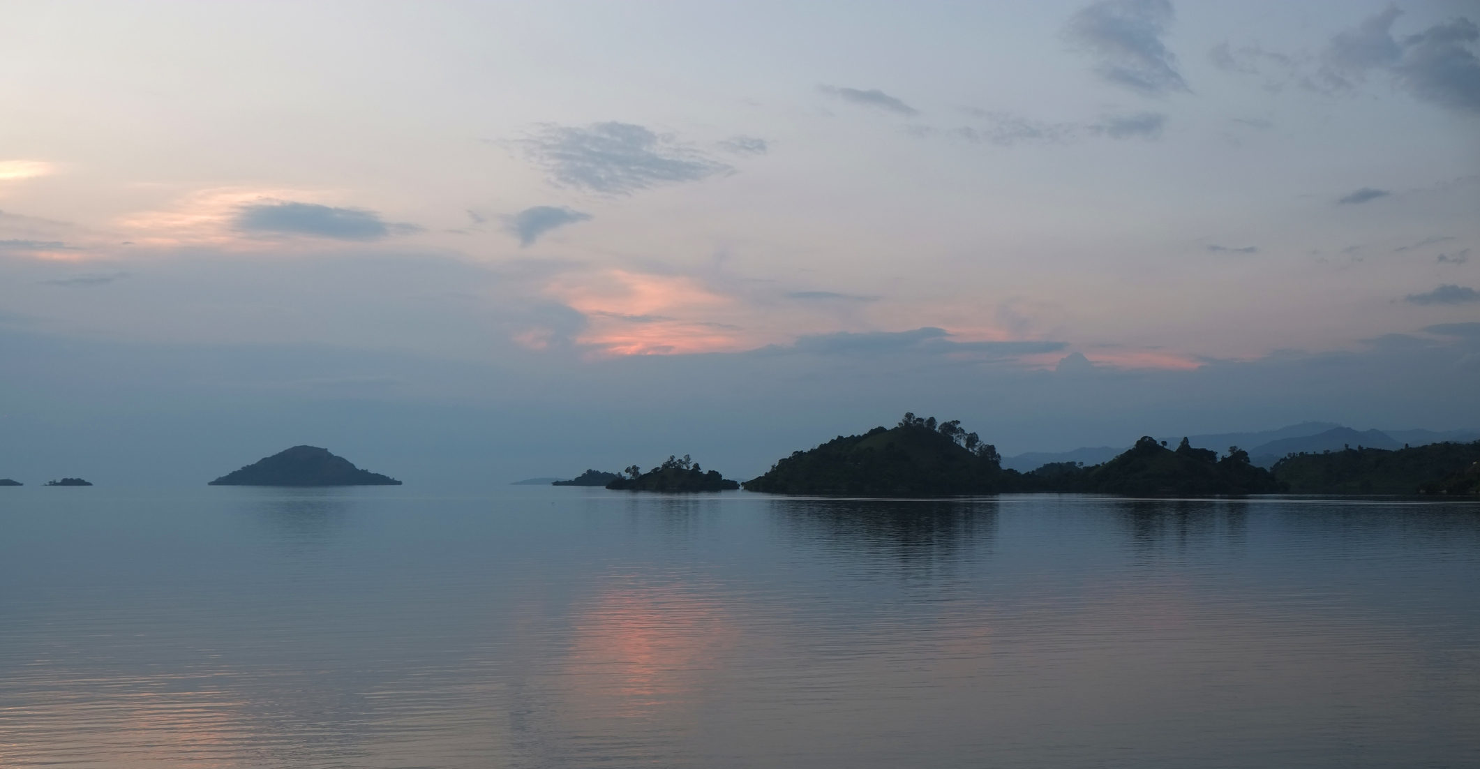 Witness extraordinary landscape in Kibuye, Rwanda like this sunset over Lake Kivu when you take a tailor-made holiday with Alfred&