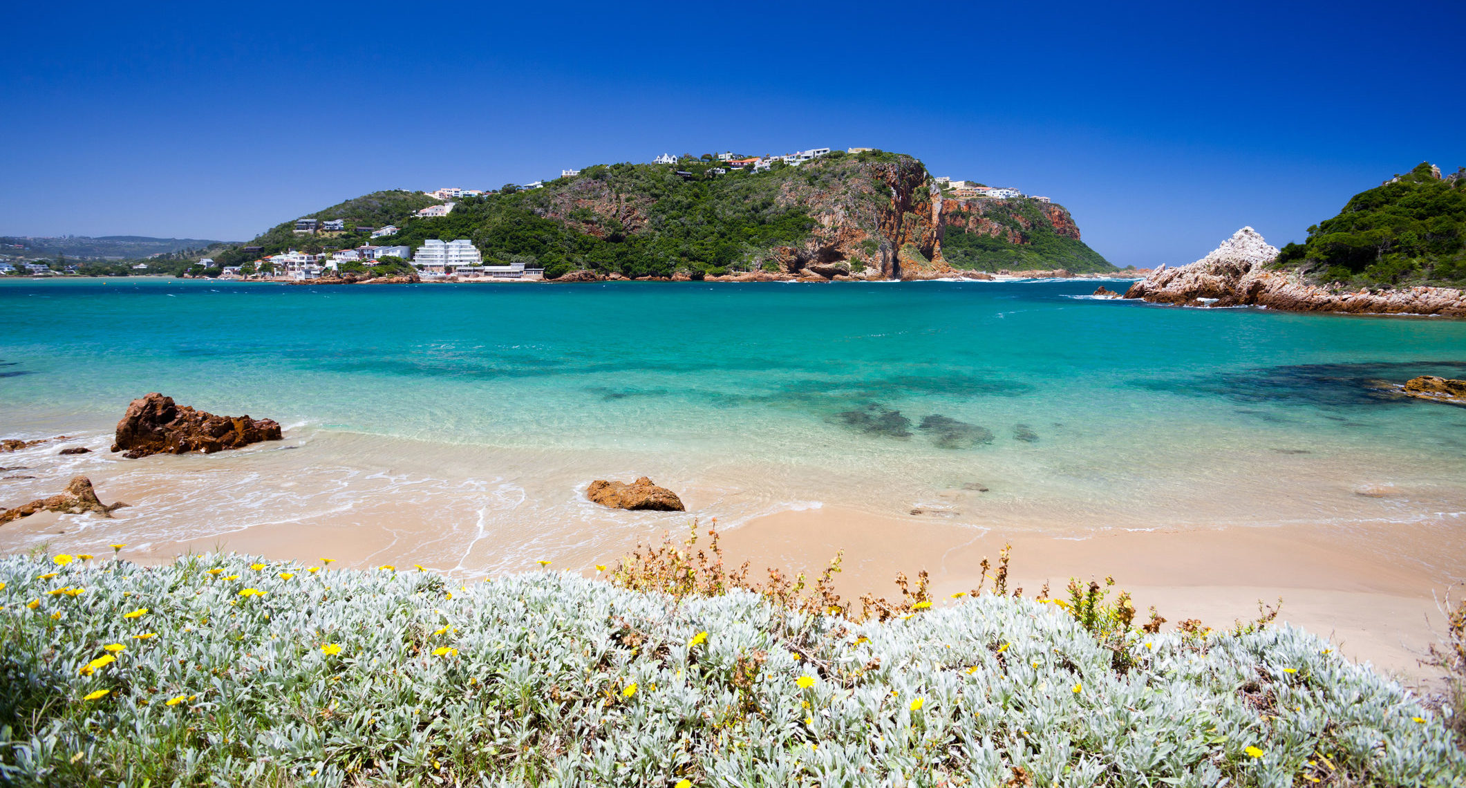 Discover remarkable South African sights like this beautiful view of Knysna beach when you take a tailor-made holiday with Alfred&.