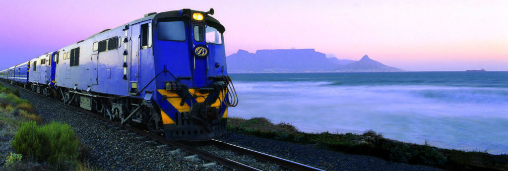 Experience remarkable South African sights like this view of Table Mountain from the iconic Blue Train when you take a tailor-made holiday with Alfred&.