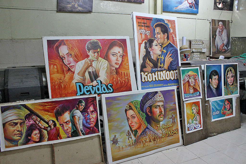 Experience authentic Indian culture like in this Mumbai shop selling Bollywood posters when you take a tailor-made holiday with Alfred&.