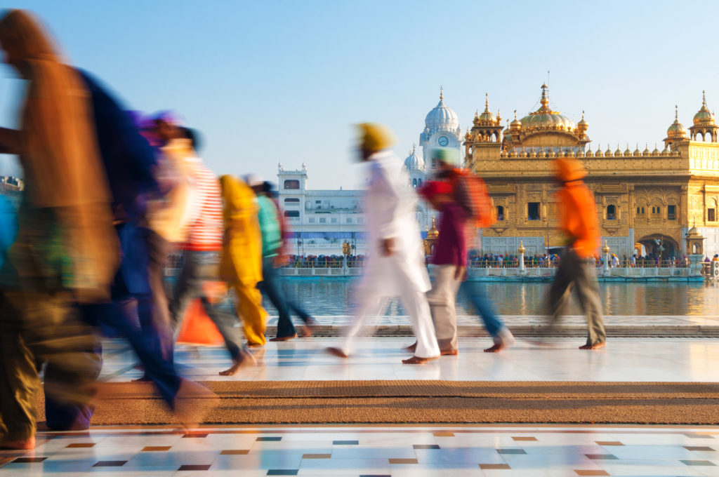 Experience authentic sights like these Sikh pilgrims walking to Amritsar’s Golden Temple when you take a tailor-made holiday with Alfred&.
