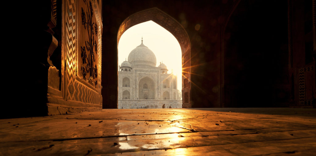 Experience extraordinary sights like this view of the Taj Mahal at sunrise in Agra when you take a tailor-made holiday with Alfred&.