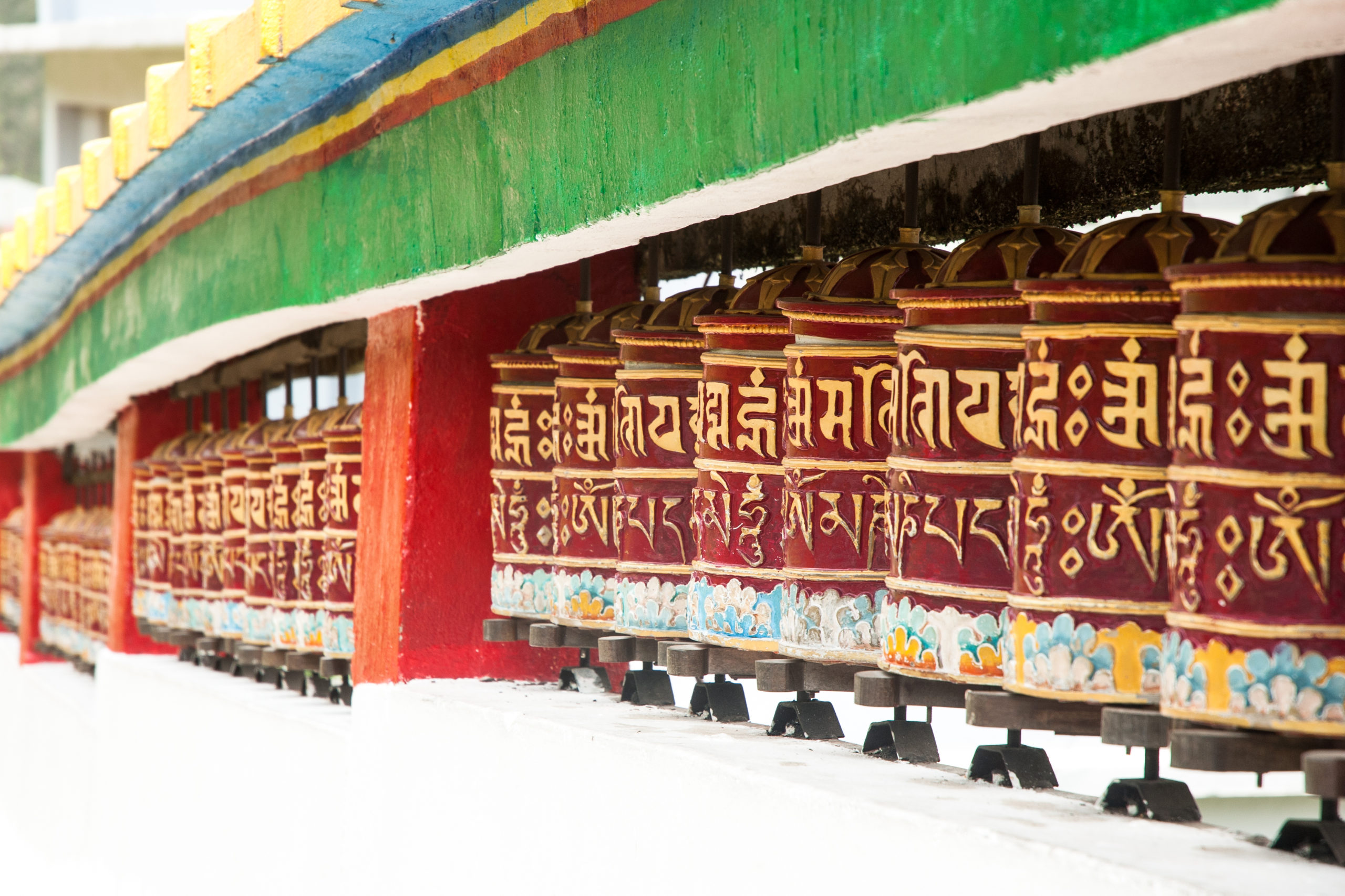 Experience extraordinary Indian sights like this long row of prayer wheels in Gangtok when you take a tailor-made holiday with Alfred&.