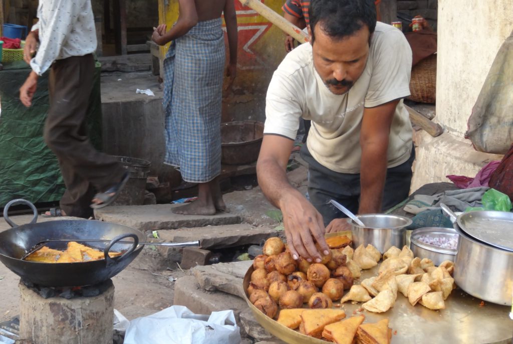 A local street-food vendor in one of Varanasi’s northern bazaars
