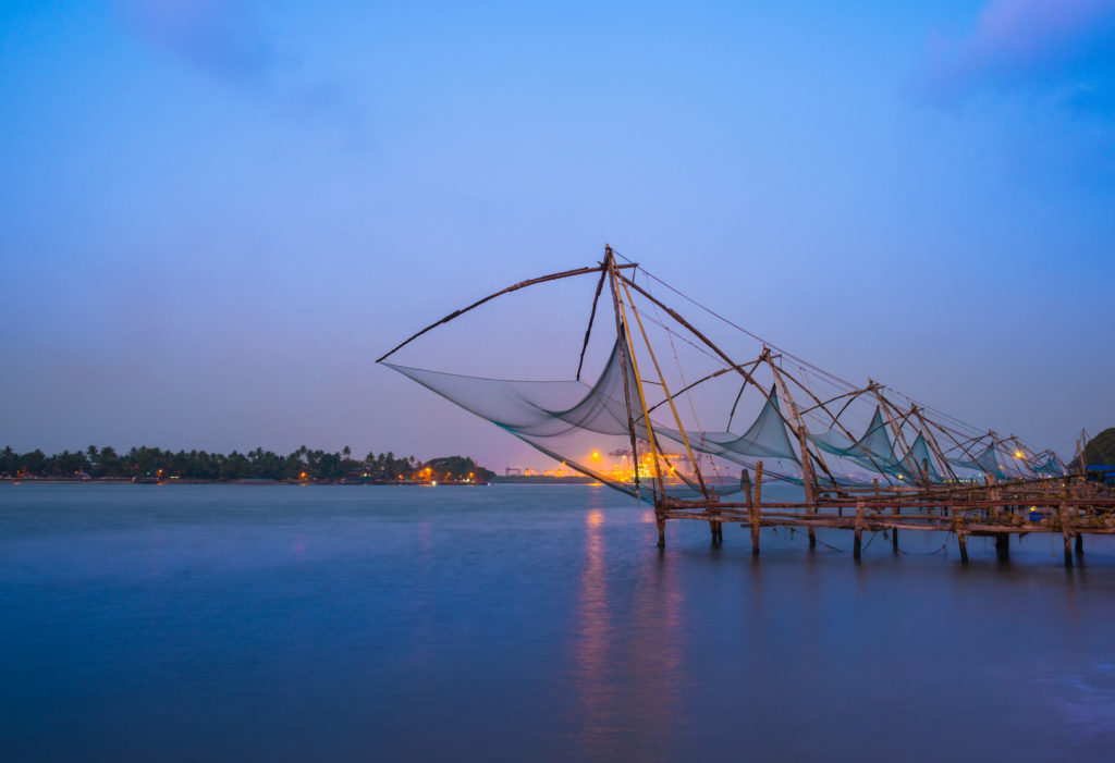 Experience extraordinary Indian sights like these Chinese fishing nets at sunrise in Cochin when you take a tailor-made holiday with Alfred&.