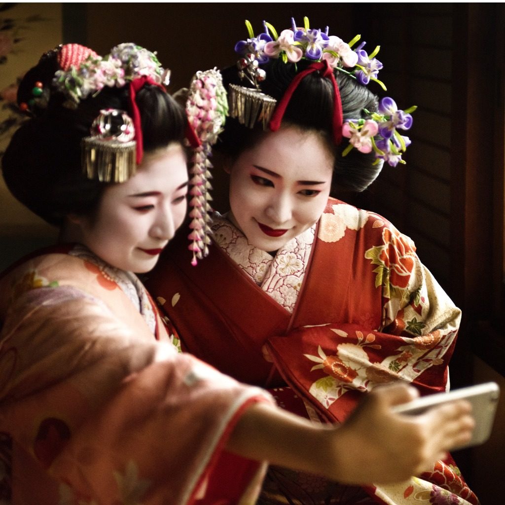 Maiko girls taking a selfie, Japan