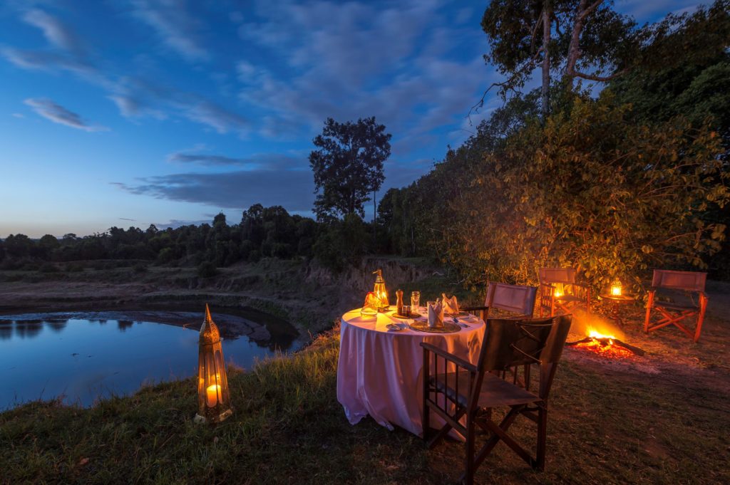 Enjoy extraordinary Kenya experiences like this private bush dinner at Governors' Il Moran Camp