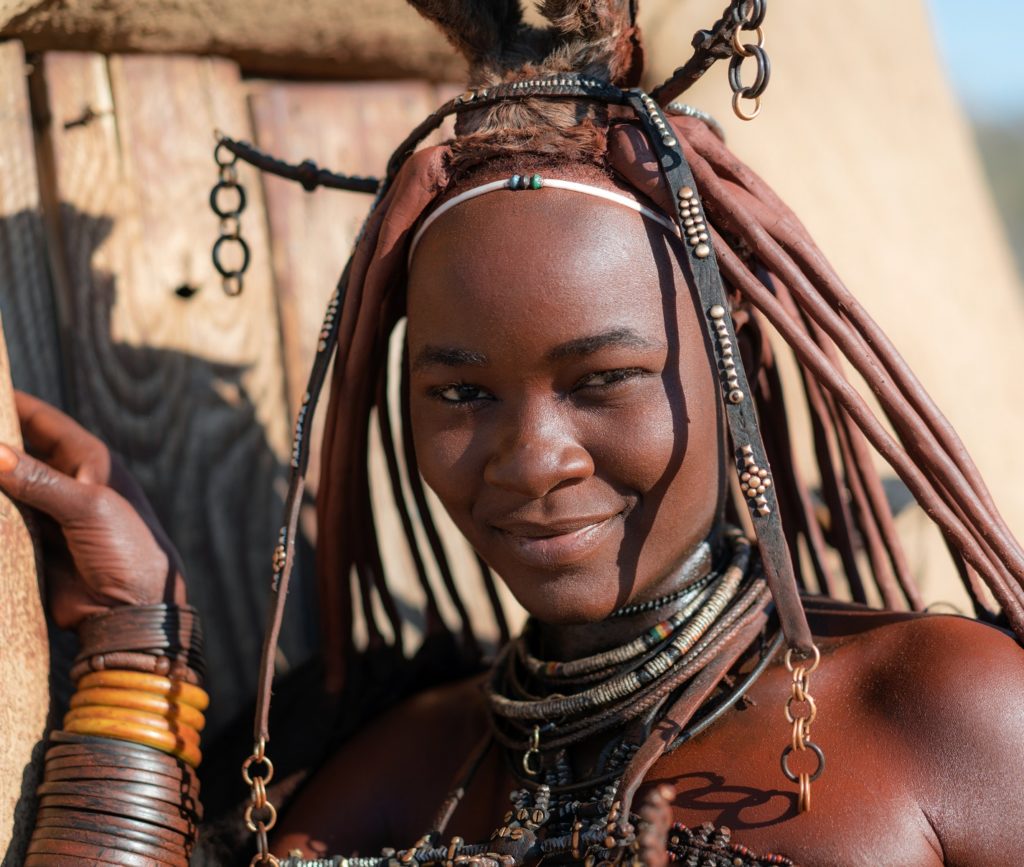 Young Himba woman dressed in traditional style in Namibia, Africa