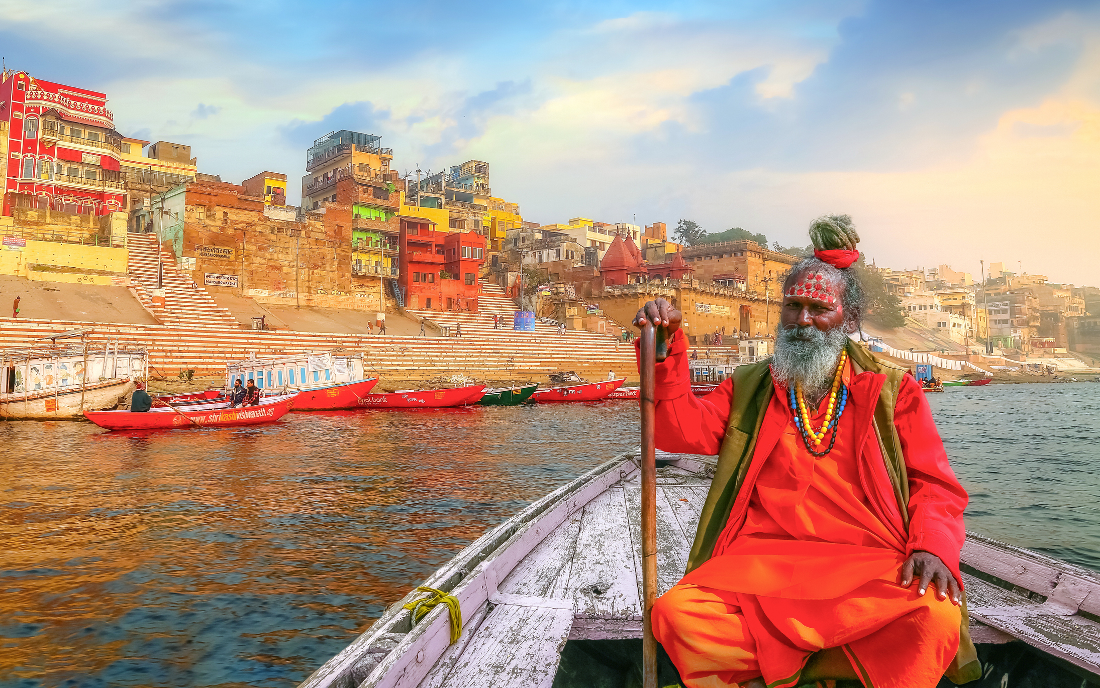 Indian sadhu on a boat on the Ganges in Varanasi 