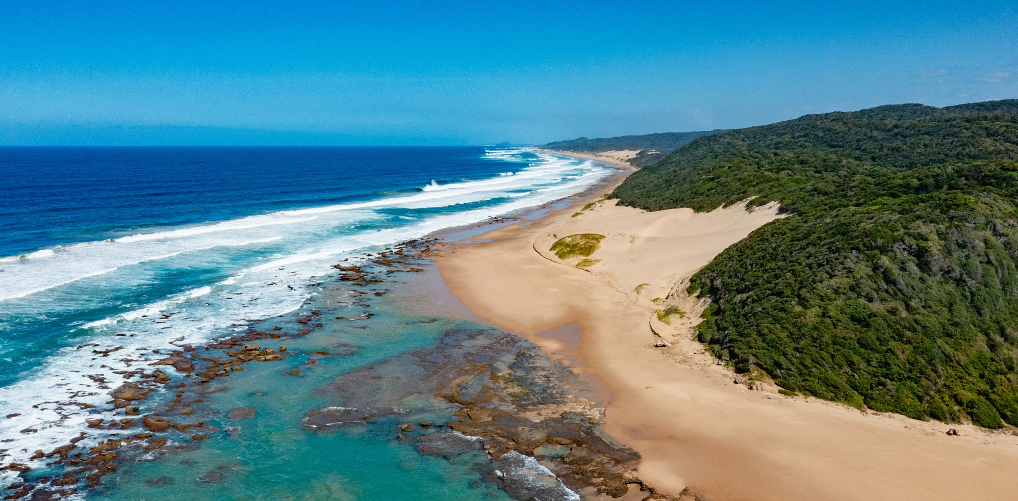Discover extraordinary natural scenery like this coast on the iSimangaliso Wetland Park when you take a tailor-made trip with Alfred&