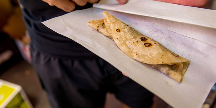 Dholl puri wrapped in paper