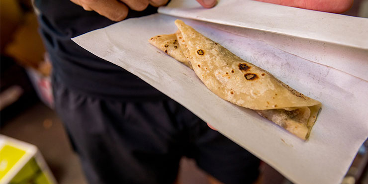 Dholl puri wrapped in paper